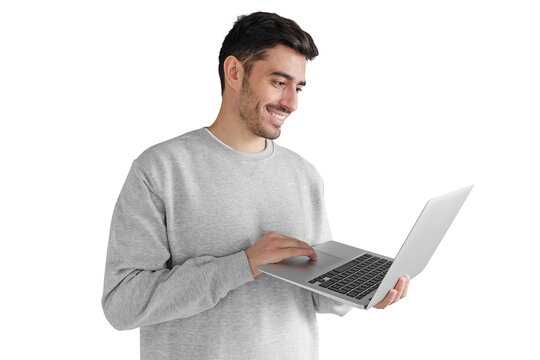 Young man in gray sweatshirt holding laptop and smiling