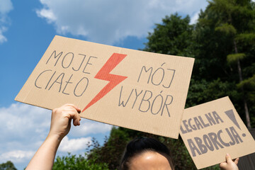 Abortion rights protest in Poland. Women's Strike rally demonstration after death of young pregnant woman. Placard signs, Moje ciało, mój wybór is My body, my choice. Legalna aborcja is legal abortion
