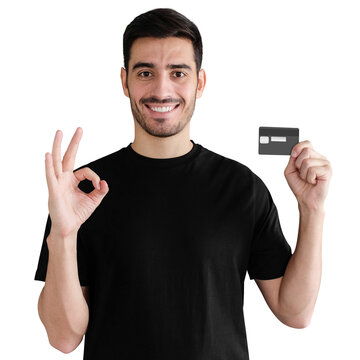 Young Man In Black T-shirt, Holding Credit Card And Showing OK Gesture