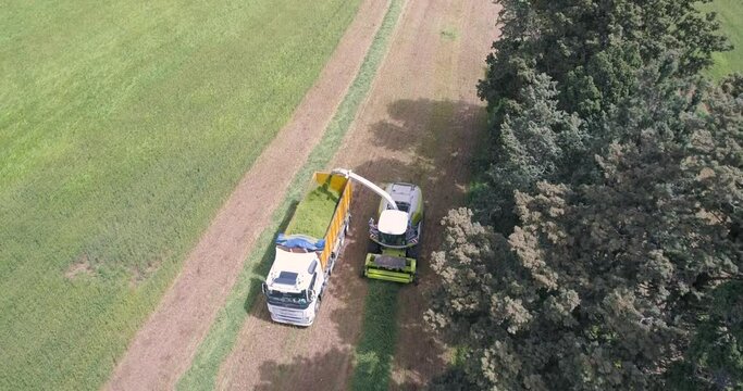 Aerial view of a agricultural machinery at action in a wheat field, Kibbutz Saar, Israel.