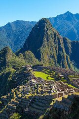 Machu Picchu Inca ruins in vertical format, Machu Picchu Historical Sanctuary, Cusco, Peru.
