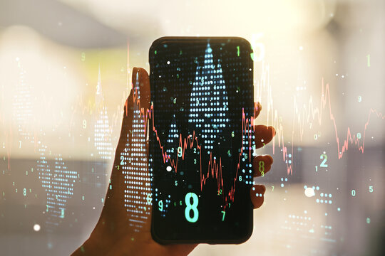 Multi exposure of abstract financial diagram and hand with cellphone on background, banking and accounting concept