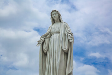 Fototapeta na wymiar Our Lady of grace Virgin Mary catholic religious statue