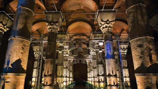 Interior view of the Theodosius cistern in Istanbul, Turkey. A lot of columns, twilight with illumination, pathway