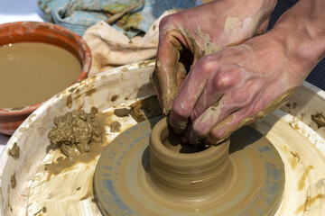 Potter's hands . ceramic ware of clay. pottery