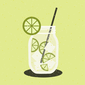 Glass of water with ice, lime slices and straw on a yellow background.