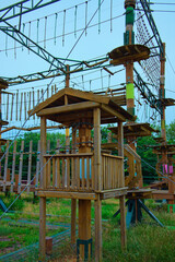 Detailed view equipment in Rope adventure attraction in the park near Dnipro River in Kyiv, Ukraine. Designed for beginners among the children. Cloudy sky background