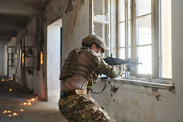 A professional soldier carries out a dangerous military mission in an abandoned building