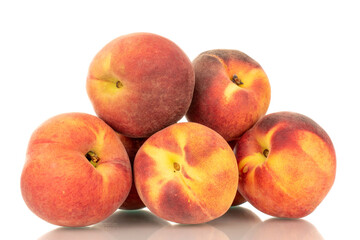 Fototapeta na wymiar Several ripe organic peaches, macro, isolated on white background.