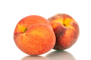 Fototapeta na wymiar Two ripe organic peaches, macro, isolated on white background.