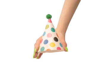 Colorful birthday cap in woman hands isolated on white background