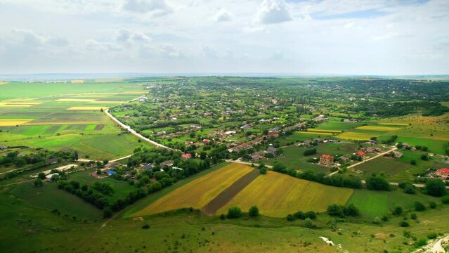 Aerial drone view of Fetesti, Moldova. Village with multiple residential buildings and greenery