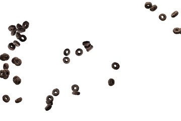 Chocolate rings cereal spill out into a bowl. Breakfast.