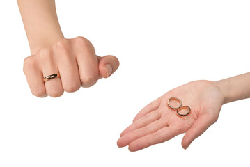 Two golden rings in a woman hand isolated on a white background.