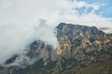 Mountain landscape. A cloud on a mountain during a cool summer day.