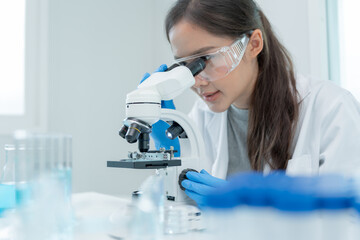 Scientist analyze biochemical samples in advanced scientific laboratory. Medical professional use...