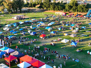 A Community Gathering in Yucaipa, California, celebrating a Holiday on the 4th of Jul, Independence Day, looking at People Enjoying the Open-Air Event