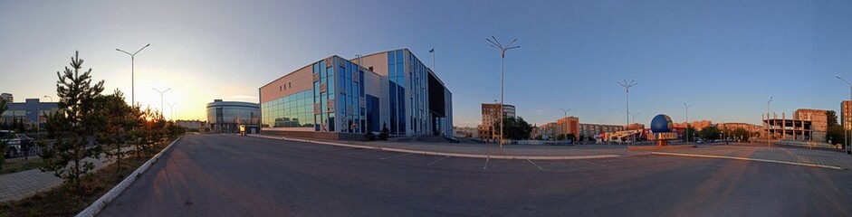 Panorama of the street of Kazakhstan. Modern building of the "House of Friendship of the Assembly of the People" of Kazakhstan.