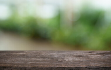 Empty wood table top and blur of out door garden background Empty wooden table space for text marketing promotion. blank wood table copy space for background