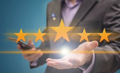 A conceptual wallpaper with 3d rendered rating stars and a person in the background 