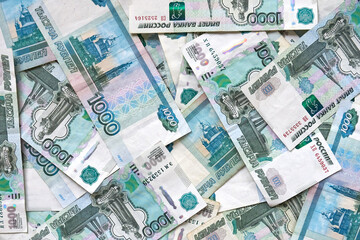 A background of banknotes of 1000 rubles. Currency exchange rate