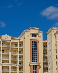 High-rise condominium building set against bright blue skies