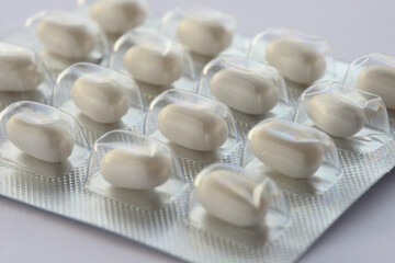 Fototapeta na wymiar Detail of white pills in packaging