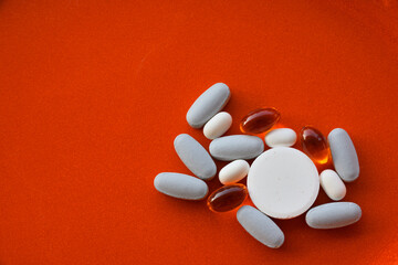 Group of blue, white and orange pills