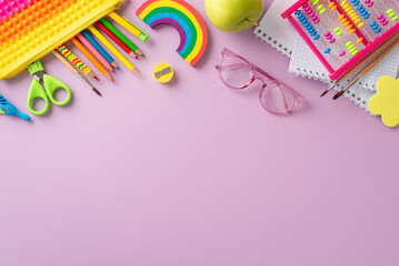 Engage in early childhood education with this captivating top-down image: an assortment of colorful child stationery arranged on violet isolated background, offering copyspace for text or advertising