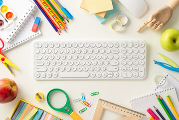Engage in remote learning with top-view shot, showcasing keyboard, mouse, albums and paint, school supplies and snacks on white background. Utilize available space for text or promotional messages