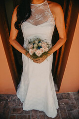 bride in wedding dress with flowers
