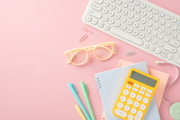Get back into the learning groove! Top view of notepads, pens, glasses, calculator, pc keyboard and other essentials on a pastel pink backdrop. Utilize the space for text or advertising purposes