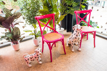 A Dalmatian dog toy with black spots for decoration at home.