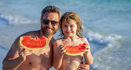fatherhood of dad with son at the beach. hispanic happy father dad and son enjoying quality time together at sea. dad and son eating watermelon. dad fatherhood and son on summer vacation