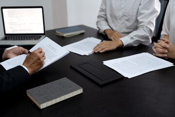 Business brainstorming meeting Executives reviewing a draft document