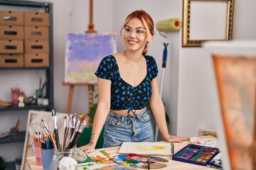 Fototapeta premium Young caucasian woman artist smiling confident standing at art studio