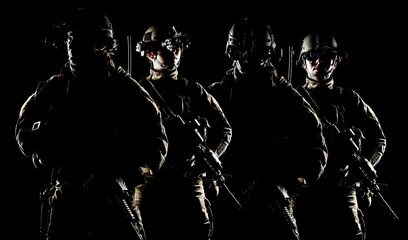 United States Army rangers with assault rifle on dark background - obrazy, fototapety, plakaty
