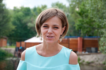 woman embracing the summer outdoors. Carefree woman with short stylish hair. woman in summer style....