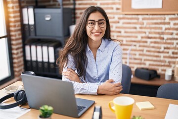 Young hispanic girl business worker using laptop working at office