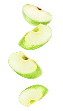 Four falling pieces of green apple fruit cut out no background