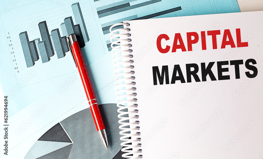 Poster capital markets text written on notebook with chart