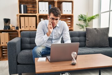 Young hispanic man psychologist having online session at psychology clinic