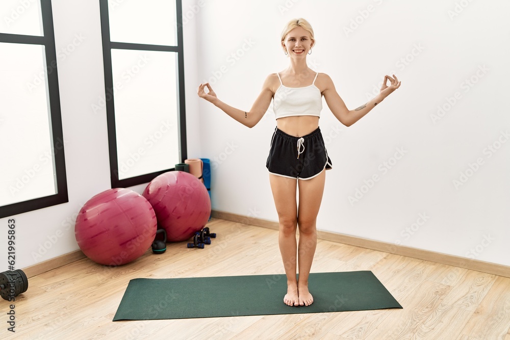 Canvas Prints Young blonde woman smiling confident training yoga exercise at sport center