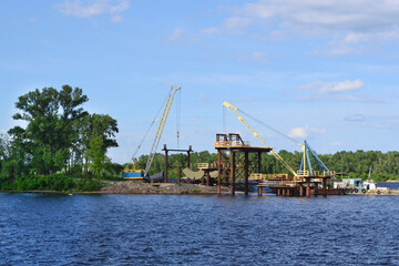 Fototapeta premium Repair works are underway on the banks of the Dnipro River