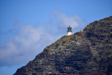 lighthouse in the mountains - obrazy, fototapety, plakaty