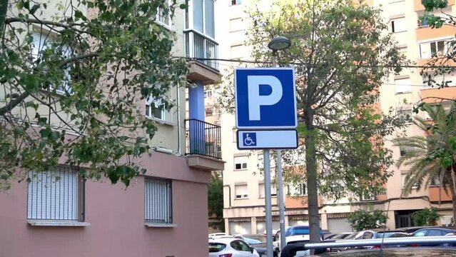 Parking disabled traffic sign. Street symbol with wheelchair. There is a parking lot for people with reduced mobility. This location is the most accessible place to park a car.