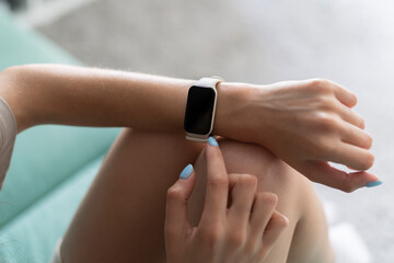 girl using smart watch to check her health