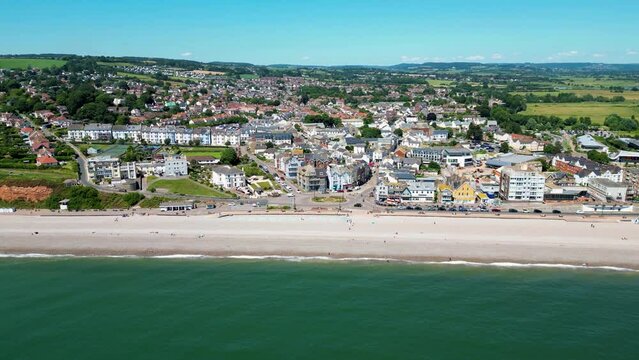 Ascending over the town of Seaton and the beach, Devon, UK.