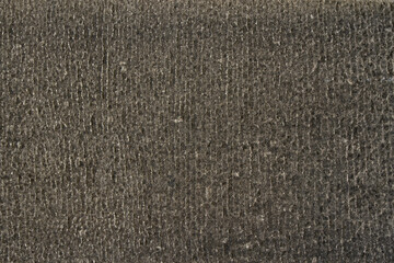 Dark grey cracked stone texture. Slate pattern