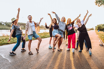Obraz premium dancing cheerful attractive women at sunset. 